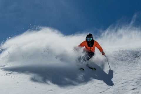 Skier going down the slopes of Sierra Nevada in Granada, Andalusia