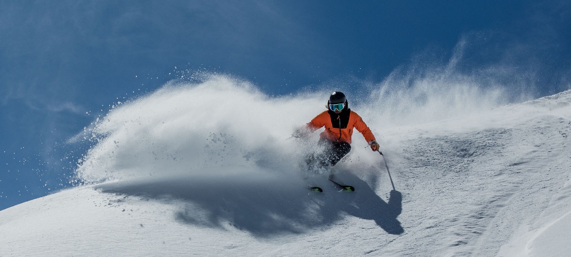 Skier going down the slopes of Sierra Nevada in Granada, Andalusia