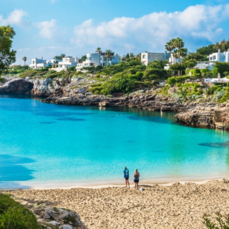 Tourists at Cala Esmeralda, located in Cala d’Or in Mallorca, Balearic Islands