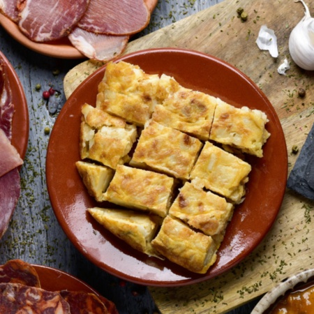 Iberico ham and potato omelette, traditional Spanish dishes.