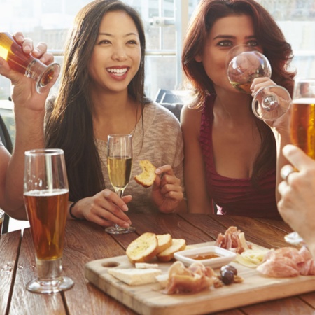 Friends enjoying tapas on a terrace