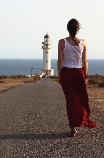 Tourist at a lighthouse in Formentera, Balearic Islands