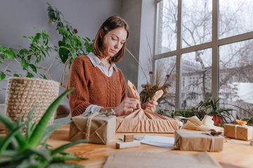 Shop assistant wrapping a purchase