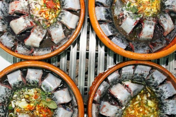 Tasting dishes at the Lamprey Festival in Arbo (Pontevedra, Galicia)