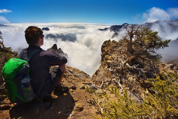 Hiker contemplating the views at the top of the mountain