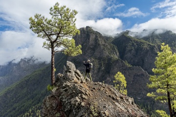 Hiker taking a photo from the top of the mountain