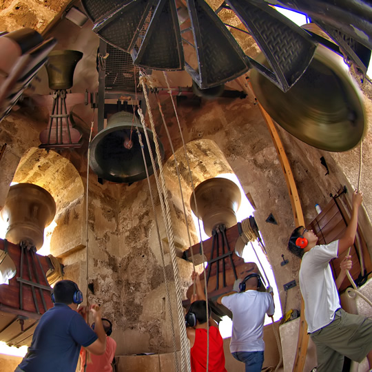 Bell ringers ringing the bells inside the bell tower, Albaida