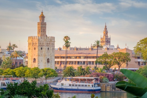 The Torre del Oro with the Giralda in the background, in Seville, Andalusia