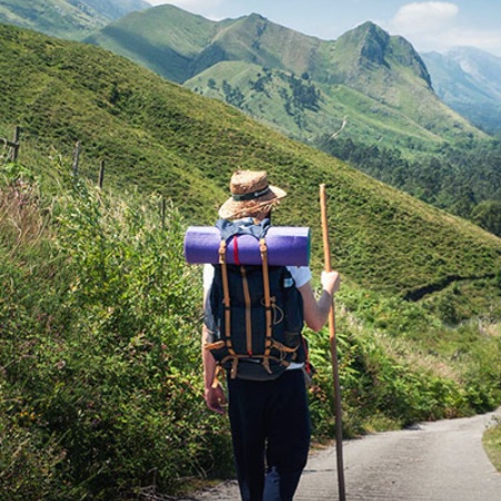 Pilgrim walking among mountains