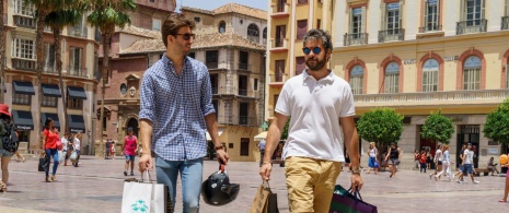 Tourists shopping in the old quarter in Málaga, Andalusia