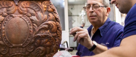 Detail of craftsmen in a precious metalwork workshop in Utrera (Seville), Andalusia