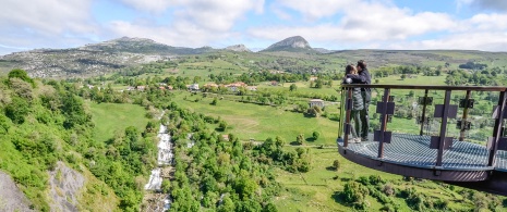 Tourists admiring the views from the Cascadas del Gándara viewpoint