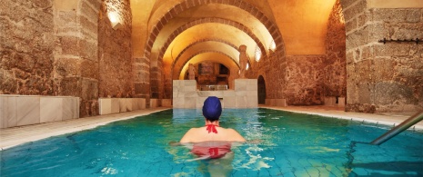 Tourist in thermal pool of Baños de Montemayor in Caceres, Extremadura