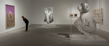 Visitor looking at paintings at the Reina Sofia Museum in Madrid