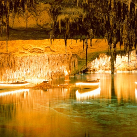 Boats on the lake inside the Drach Caves