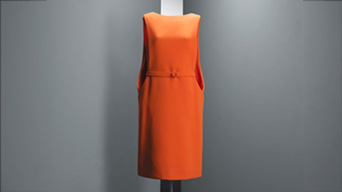 Knee-length orange wool crepe daytime dress, with a boat neckline and short sleeves. Paris, circa 1968