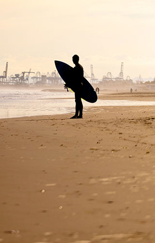 Surfer on Malvarrosa beach in Valencia