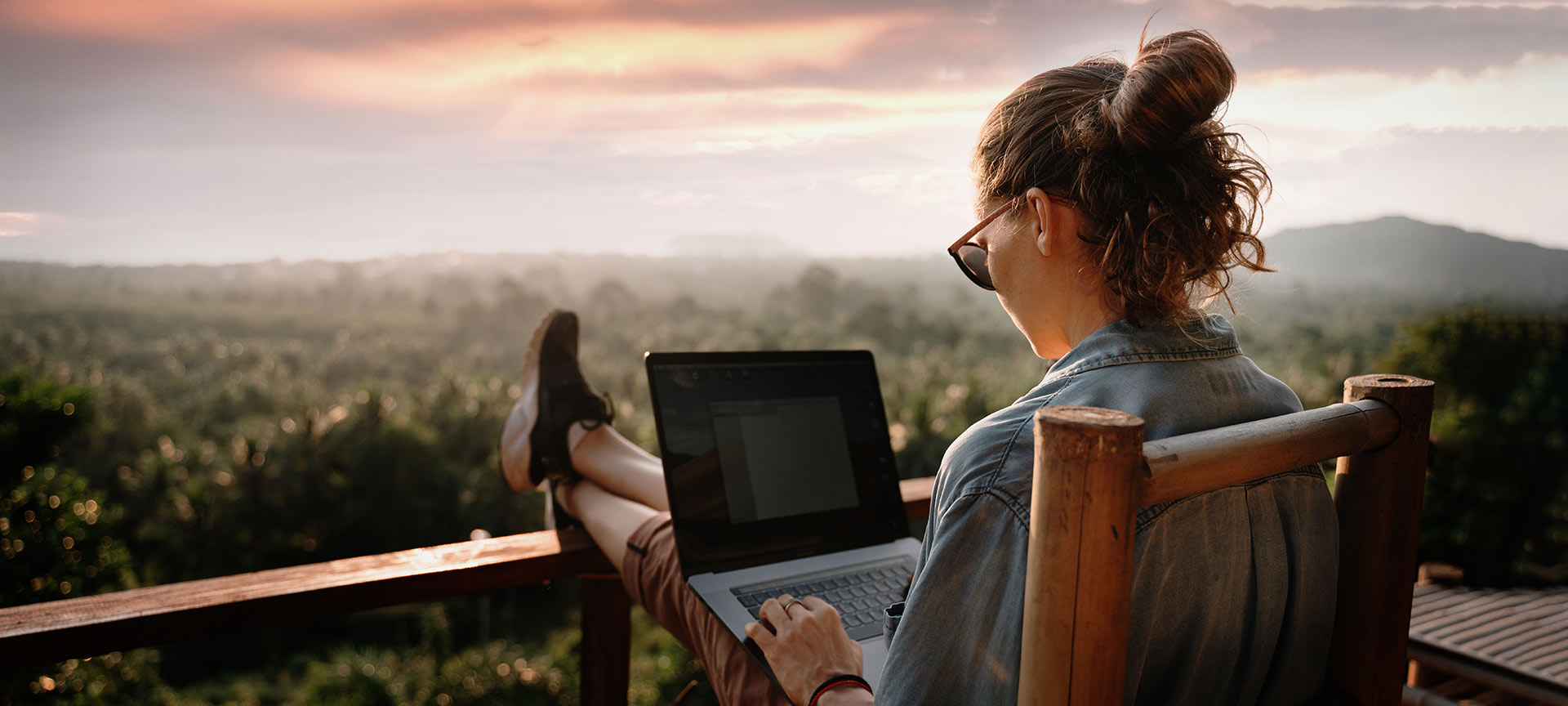 Girl working with countryside views Girl working with countryside views