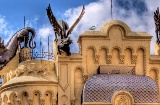 Detail of the roof of a house with dragon figures, in Ceuta