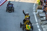 Several competitors reaching the finishing line in the Grand Prix de Carrilanas in Esteiro, A Coruña