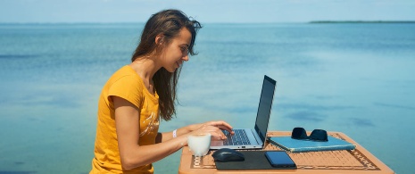 Girl working on the seashore