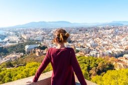 Tourist looking at the city of Malaga, Andalusia